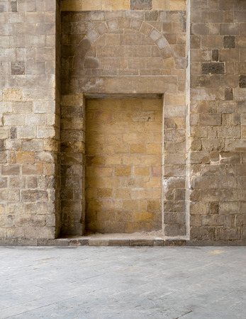 Recessed frames in an old stone bricks wall, Medieval Cairo, Egyptの写真素材