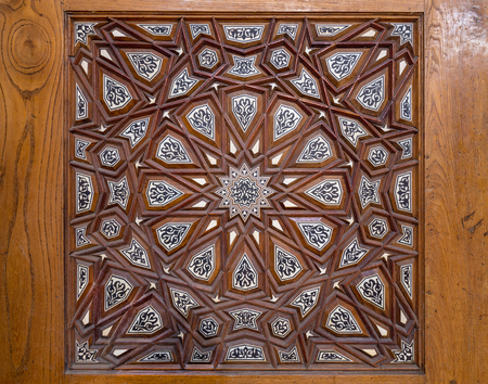 Closeup of arabesque ornaments of an old aged decorated wooden door, Old Cairo, Egyptの写真素材