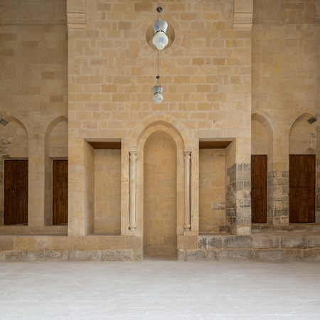 Public Mosque attached to Al-Muayyedi Bimaristan historic building, with Mihrab (niche) engraved in bricks stone wall, Darb Al Labana district, Old Cairo, Egyptのeditorial素材