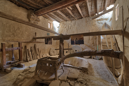 Cairo, Egypt - March 24 2018: Ancient rotary Flour Mill used to be rotated by animal power at the Monastery of Saint Paul the Anchorite (aka Monastery of the Tigers), dates to the fifth century AD and located in the Eastern Desert, near the Red Sea mountaのeditorial素材