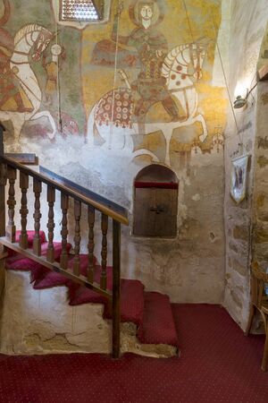 Cairo, Egypt - March 24 2018: Wall with Coptic fresco paintings and staircase leading to the Church of St. Paul & St. Mercurius, Monastery of Saint Paul the Anchorite (aka Monastery of the Tigers), Egyptのeditorial素材