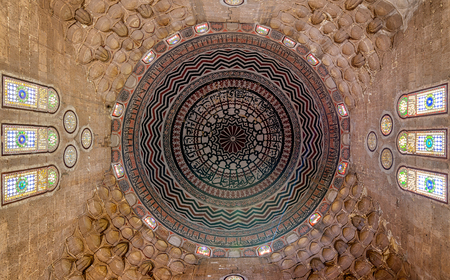 Colorful decorated painted dome, Ceiling of Al Zaher Barquq mausoleum with stained glass windows, Old Cairo, Egyptのeditorial素材