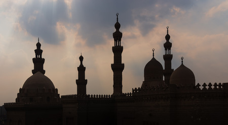 Silhouette shot of minarets and domes of  Sultan Hasan mosque and Al Rifai Mosque, Old Cairo, Egyptのeditorial素材