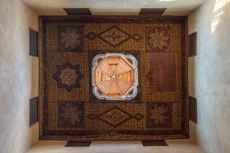 Ottoman era decorated wooden ceiling with floral pattern decorations and wooden dome at historic House of Egyptian Architecture, located in Darb El Labbana district, Cairo, Egyptのeditorial素材