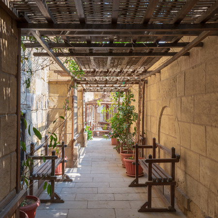 Passage ceiled with wooden pergola leading to the House of Egyptian Architecture historical building from the Mamluk era, Cairo, Egyptのeditorial素材