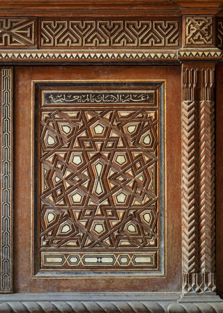 Single arabesque sash of an old mamluk era cupboard with geometrical decorations, Zeinab Khatoon historic house, Cairo, Egyptのeditorial素材