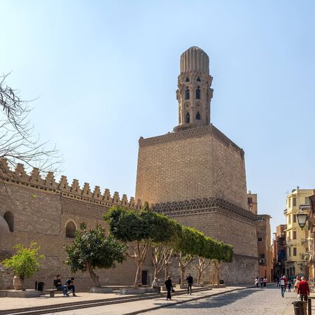 Cairo, Egypt- March 21 2015: Minaret of public historic Al Hakim Mosque known as The Enlightened Mosque, located in Moez Street with walking local residents, Old Cairoのeditorial素材