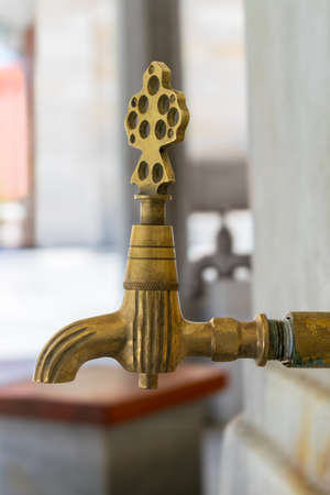 Turkish Ottoman style antique ablution tap at the ablution fountain outside of Fatih Mosque, Istanbul, Turkey, includes clipping pathの写真素材
