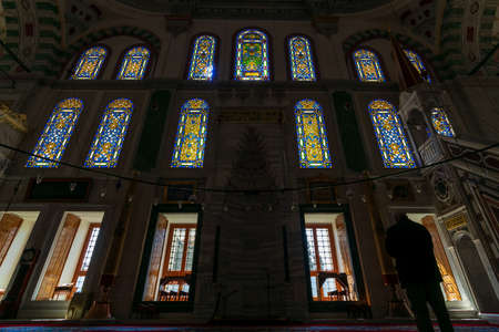 Silhouette shot of group of colorful stained glass at public ottoman Fatih Mosque, located in Fatih district of Istanbul, Turkeyの写真素材