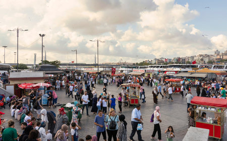 Istanbul, Turkey - August 30, 2022: Crowds of local citizens at Eminonu Plaza during the Victory Day holiday with background of Istanbul city viewのeditorial素材