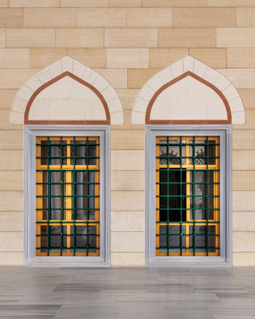 Two adjacent wrought iron arched windows with modern architectural design at the courtyard of Camlica Mosque, Istanbul, Turkeyの写真素材