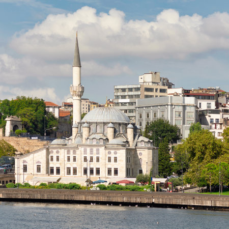 View from Golden Horn overlooking Ottoman imperial Sokollu Mehmed Pasha Mosque, suited beside Ataturk Bridge, at Azapkapi neighborhood of Beyoglu district, Istanbul, Turkeyのeditorial素材