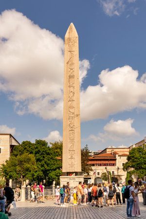 Istanbul, Turkey - August 30 2022: Tourists visiting the Obelisk of Theodosius, ancient Egyptian obelisk of Pharaoh Thutmose III re-erected in the Hippodrome of Constantinople, or Sultanahmet Squareのeditorial素材