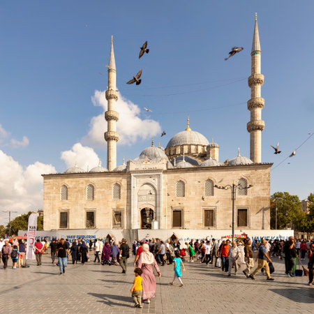 Istanbul, Turkey - August 30, 2022: Crowds of local citizens at Eminonu during the Victory Day holiday with the New Mosque, or Yeni Camii in the background,のeditorial素材