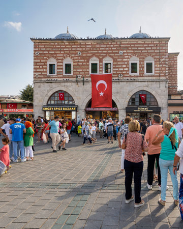Istanbul, Turkey - August 30, 2022: Crowds of local citizens at Eminonu during the Victory Day holiday with entrance of The Spice Bazaar, aka Misir Carsisi, or Egyptian Bazaar in the backgroundのeditorial素材