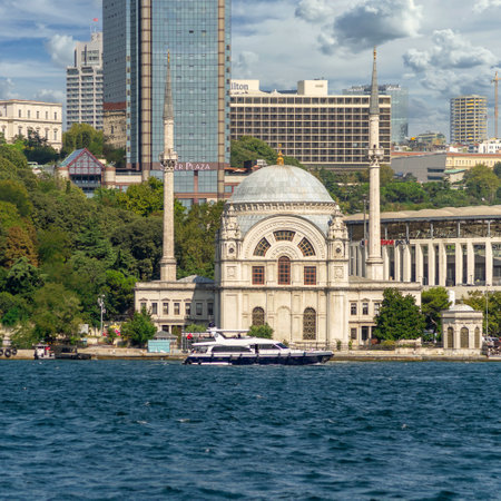 Istanbul, Turkey - August 29, 2022: View from Bosphorus Strait overlooking baroque waterside Dolmabahce Mosque, suited at the waterside of Kabatas, in Beyoglu districtのeditorial素材