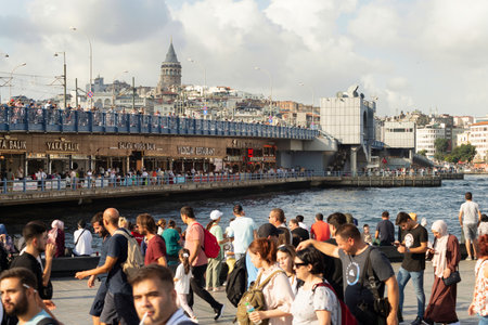 Istanbul, Turkey - August 30, 2022: Crowds of local citizens at Eminonu Piazza during the Victory Day holiday with background of Istanbul city view including Galata Towerのeditorial素材