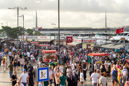 Istanbul, Turkey - August 30, 2022: Crowds of local citizens at Eminonu Plaza during the Victory Day holiday with background of Istanbul city view including Golden Horn Metro Bridgeのeditorial素材