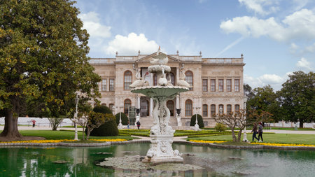 Istanbul, Turkey - May 10, 2023: Dolmabahce Palace, or Dolmabahce Sarayi, located in Besiktas district on the European coast of the Bosporus, with water fountain in front of the palaceのeditorial素材