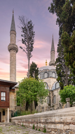 16th century Atik Valide Mosque, surrounded by tall lush trees, located in Uskudar district, Istanbul, Turkey. The photo captures the beauty of the mosque's architecture, with its towering minaretsの写真素材