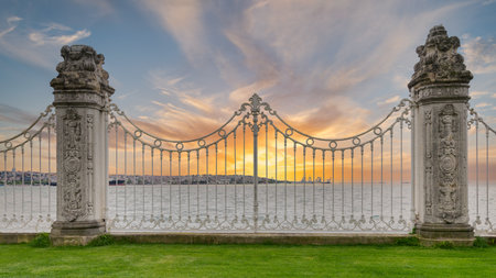Ornate wrought iron fence decorated with intricate designs at the Dolmabahce Palace overlooking the...