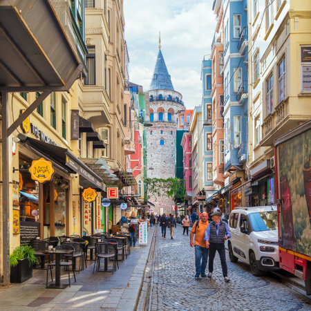 Istanbul, Turkey - May 13, 2023: Popular tourist destination Galata Tower, taken from the narrow and atmospheric cobblestone crowded Buyuk Hendek Streetのeditorial素材