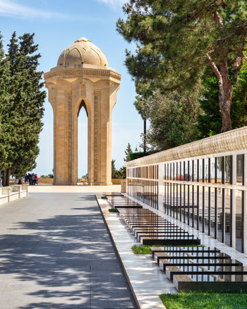 Baku, Azerbaijan - May 6 2024: Martyrs Lane, commemorates soldiers died in the Nagorno-Karabakh War. Features soldiers graves and central monument with a sone tower housing eternal flameのeditorial素材