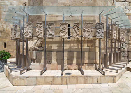 Fragments of ancient Arabic inscriptions are displayed on stone blocks in the historic courtyard of the Palace of the Shirvanshahs, showcasing the rich cultural heritage of Baku, Azerbaijan.の写真素材
