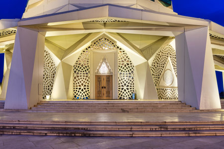 Side entrance of the Mosque of Faculty of Theology in Uskudar, Istanbul, Turkey, illuminated at...
