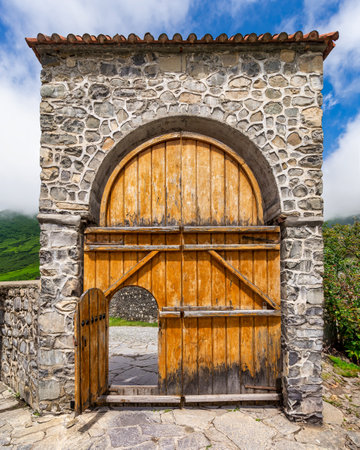 Beautifully crafted stone entrance of the Church of Kish, also known as the Church of Saint Elisha, located in the serene village of Kish, Shaki, Azerbaijanの写真素材