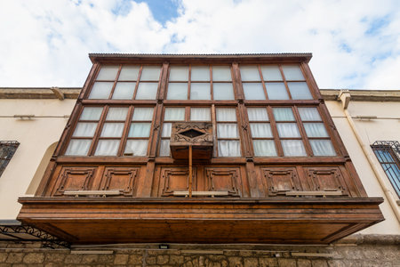 Amidst the winding streets of Icherisheher, traditional wooden balconies showcase the rich cultural heritage of Baku, Azerbaijan. The intricate details of this historic architecture are captivatingの写真素材