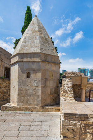 The Mausoleum of Seyid Yahya Bakuvi, located in the serene surroundings of the Old City, Icherisheher, in Baku, Azerbaijan, is renowned for its distinctive conical roof and ancient stone architectureの写真素材
