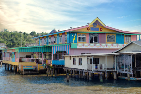 Brightly colored wooden houses line the river in Kampong Ayer, Bandar Seri Begawan, highlighting traditional Bruneian architectureの写真素材
