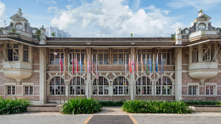 The Old Government Printing Office in Kuala Lumpur features stunning colonial architecture adorned with flags. The building reflects Malaysias rich history and cultural diversityの写真素材