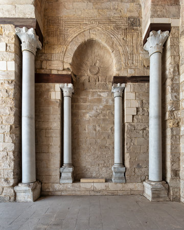 Columns stand elegantly in the historic Mosque of al-Zahir Baybars, showcasing intricate designs and ancient craftsmanship in Cairo. This site reflects the rich cultural heritage of Egyptの写真素材