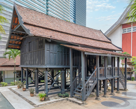 Part of Istana Satu, historic palace in Kuala Terengganu, showcases traditional craftsmanship with intricate carvings and robust chengal wood construction, reconstructed in Muzium Negara in April 1974の写真素材