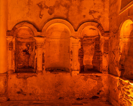 Within the confines of St. John the Baptist Church in Sirince, Selcuk, Turkey, historical frescoes adorn the walls, bathed in a warm glow that illuminates intricate religious artの写真素材