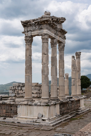 Ruins of the Temple of Trajan at ancient Pergamon, Bergama, Turkey. Roman columns against a cloudy skyの写真素材