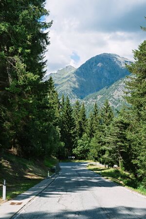 Direction sign on a mountain road in the Alps, Brusson, Italyの写真素材
