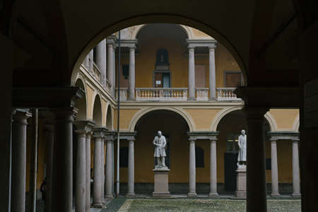 Courtyard of the famous Pavia University with monuments to scientists. University is one of the oldest schools in Europe: PAVIA, ITALY - 2020のeditorial素材
