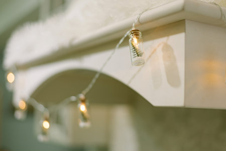 Bottle-shaped Christmas garland with Christmas trees inside hangs in the kitchen. New Years decor. Close-up. selective focusの写真素材