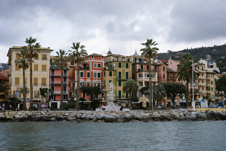 View of a beautiful city on the mediterranean coast with cloudy skies in winter time. Monument to Christopher Columbus: SANTA MARGHERITA LIGURE, ITALY - January 27, 2020のeditorial素材