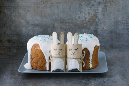 Happy easter. Traditional glazed Easter cakes on dark textured background