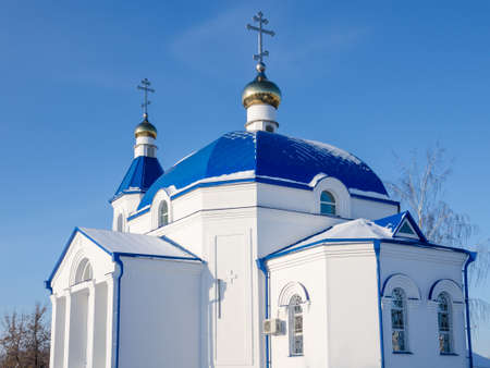 The snow-white Church of St. Andrew on a blue sky backgroundの写真素材