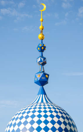 The minaret of the mosque against the blue sky. Settlement Old Arakchino. The temple of all religions. The Ecumenical temple. Kazan, Republic of Tatarstan, Russia.の写真素材