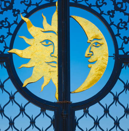 The metal gate of the tower Syuyumbike with a golden sun and moon. Historic and Architectural Complex of the Kazan Kremlin. UNESCO World Heritage Site. Kazan, Republic of Tatarstan, Russia.の写真素材
