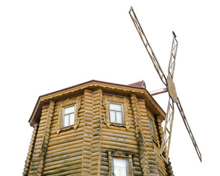 Wooden decorative windmill on a white background.の写真素材