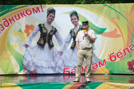 Kazan, Republic of Tatarstan, Russia - May 28, 2016: The singer Almaz Khamzin on a scene. Sabantuy (translated from Tatar - feast of the plow) is a traditional celebration of the end of spring field work. Khamzin Almaz - honoured art worker of the Republiのeditorial素材