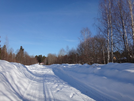 Winter road in suuny dayの写真素材
