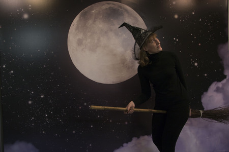 Witch, moon and clouds at night on Halloweenの写真素材